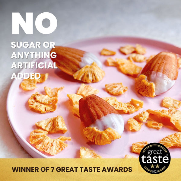 Hey! Chips pineapple crisps on a pink plate with the text: No sugar or anything artificial added. Great Taste 2021 badge – winner of 7 Great Taste awards.