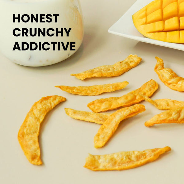 Hey! Chips mango crisps scattered with real mango on the side, with the text: Honest, Crunchy, Addictive.