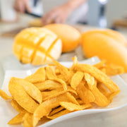 Close-up view of Hey! Chips mango banana crisps.