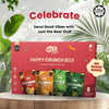 HEY! CHIPS Happy Crunch Box with various flavors on a wooden surface with greenery in the background.