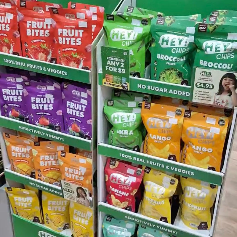 Display of various Hey! Chips  packages in a store setting.